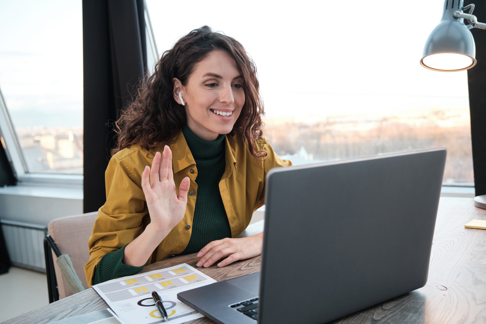 Woman Talking Online on Laptop